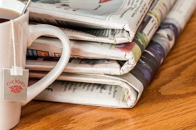 Newspaper and coffee mug